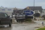 This image provided by Steven Bischer, shows an upended vehicle following an apparent tornado, Friday, May 20, 2022, in Gaylord,Mich. (Steven Bischer via AP)
