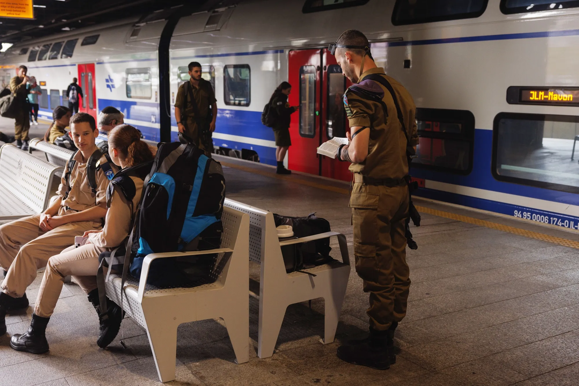 An Israeli soldier performs a prayer in a train station&nbsp;on the morning after a drone and missile attack by Iran.