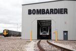 An Aventra Class 345 electric multiple-unit test train, right, manufactured by Bombarider Inc., to be used on the Elizabeth Line as part of the Crossrail project, sits on tracks in a hangar at the Bombardier Transportation UK Ltd. Rail Vehicles Production Site in Derby, U.K., on Friday, July 29, 2016. Crossrail, approved in 2008 to cut journey times across London and the Southeast, is Europe's largest construction project.