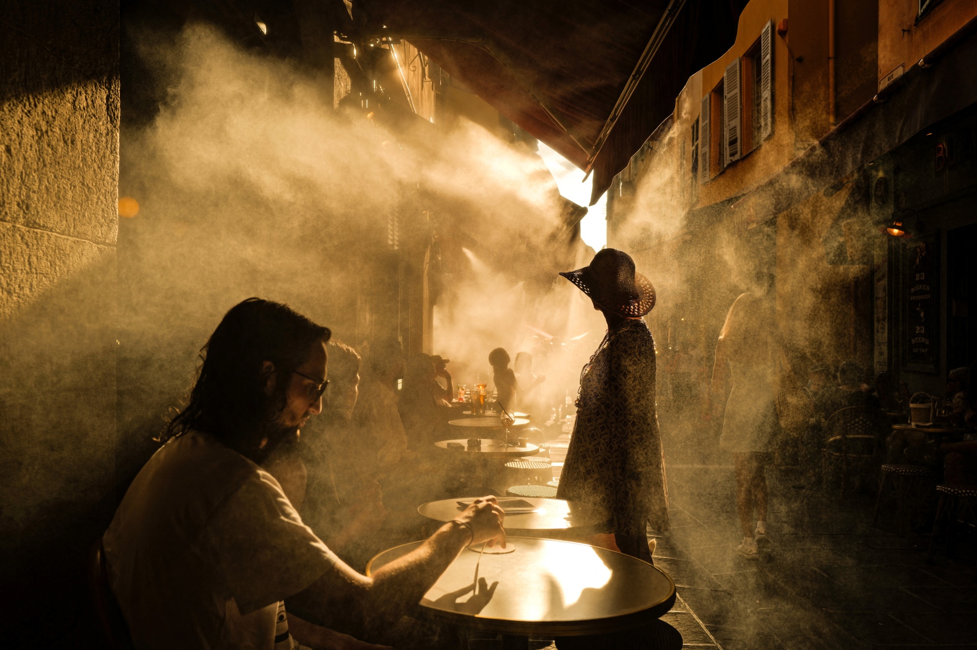 Customers at a coffee shop during a heat wave in the French Riviera city of Nice on July 6.