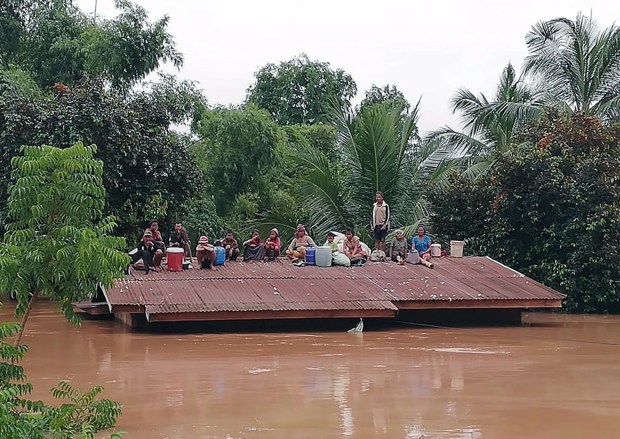 Stranded villagers&nbsp;near the site of on the hydroelectric dam collapse