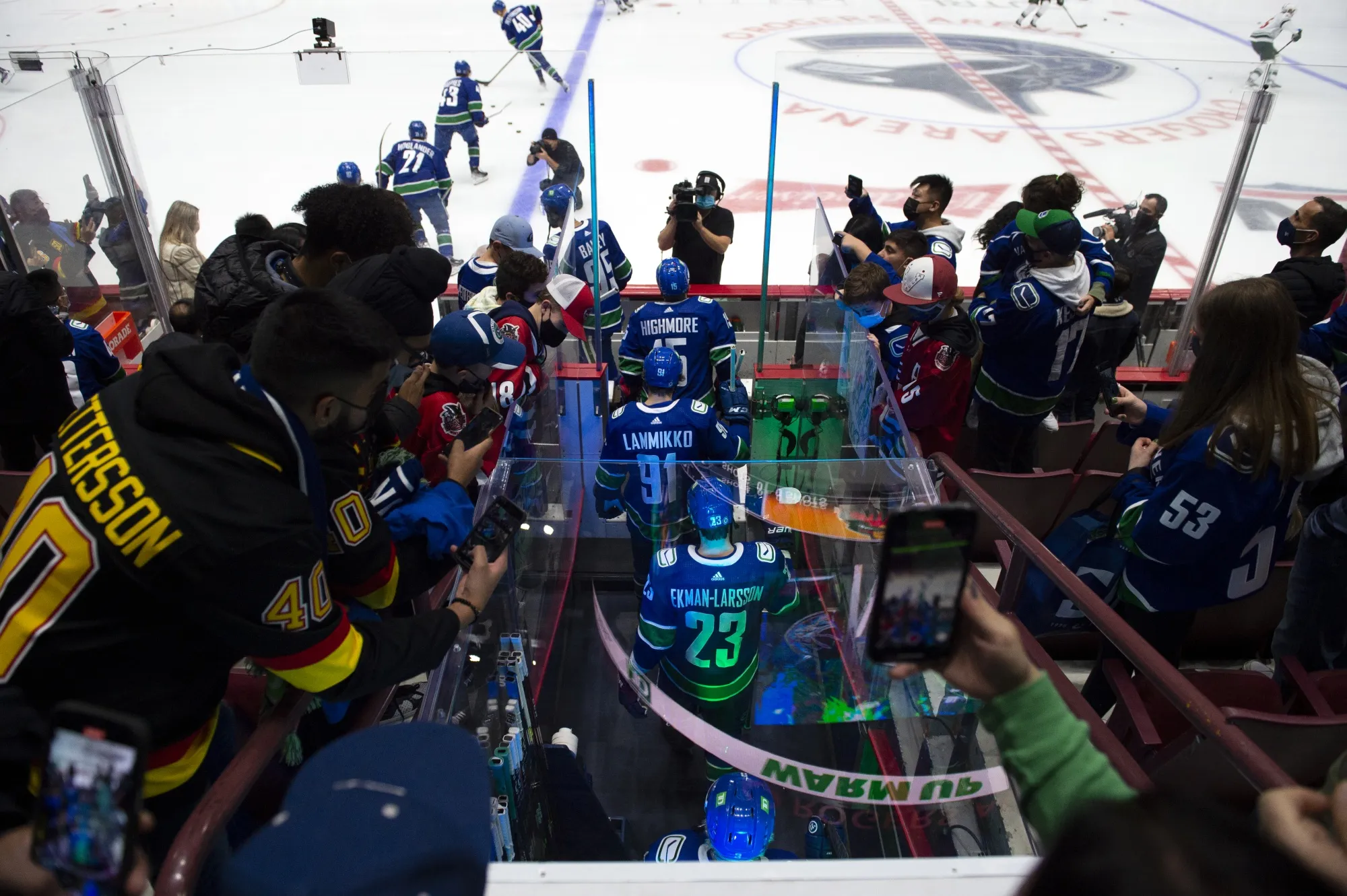 Players arrive for warm-ups during a Vancouver Canucks game at Rogers Arena in 2021.