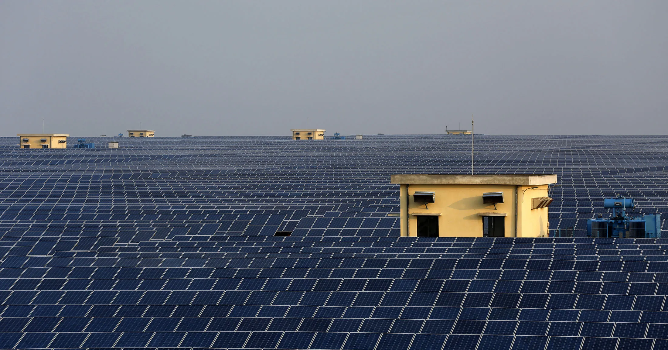 Solar panels stand at the Welspun Energy Ltd. solar power plant in Neemuch, Madhya Pradesh, India, on Wednesday, Feb. 26, 2014. Welspun, backed by Leon Black’s private-equity firm Apollo Global Management LLC, completed India’s largest solar power project as the country diversifies energy sources to combat blackouts. The 151-megawatt photovoltaic plant doubles the operating assets of Welspun Energy Ltd. and raises Indian solar capacity about 7 percent.
