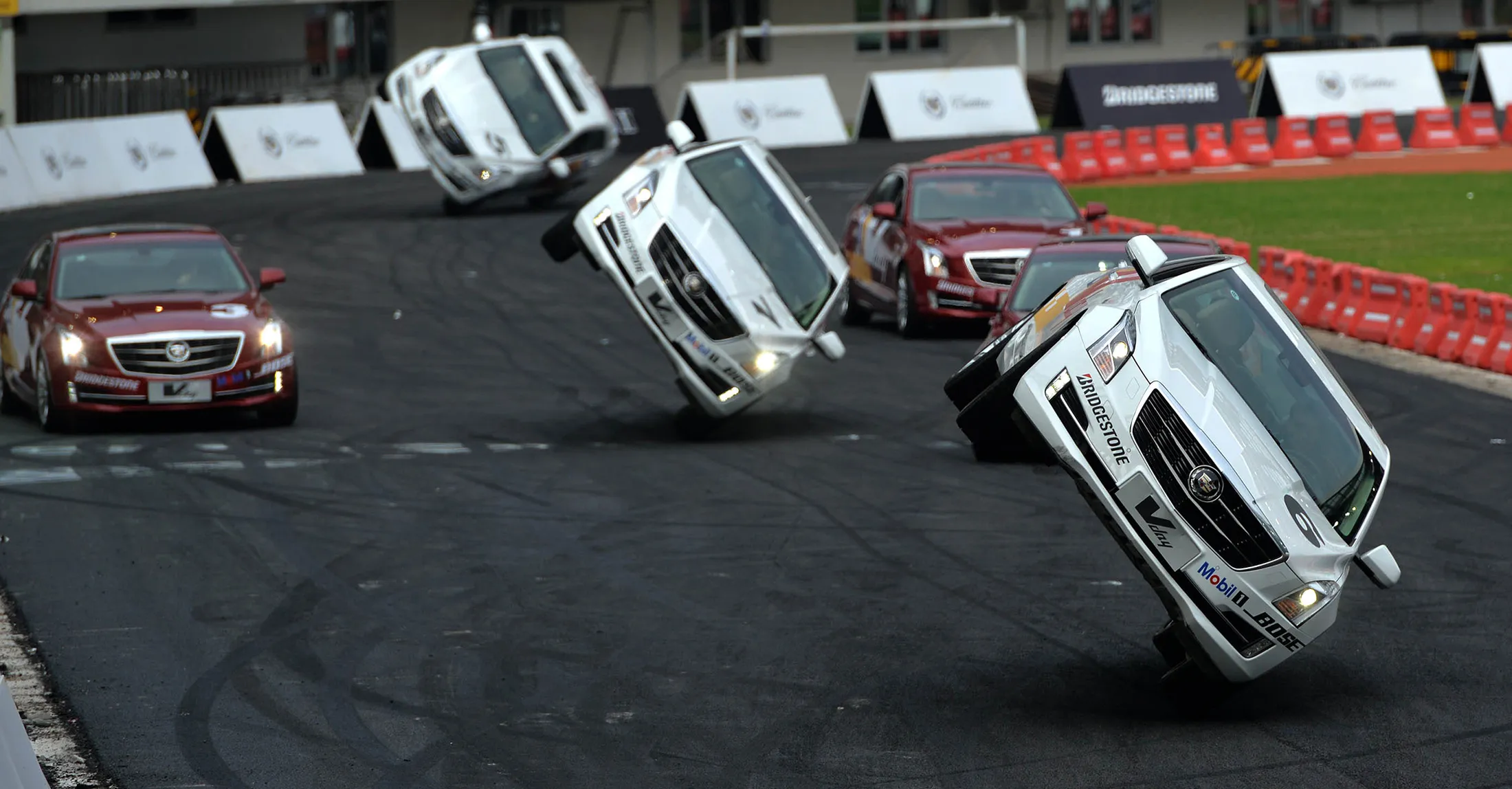 Cadillac cars perform stunts during Vday's performance show at Shenzhen Bay Sports Center.
