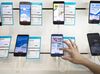 An employee demonstrates an Huawei Technologies Co. Honor 9 inside a Telenor Serbia mobile phone store, operated by Telenor ASA, in Belgrade, Serbia, on Wednesday, March 28, 2018. Telenor ASA agreed to sell its businesses in central and eastern Europe to Czech billionaire Petr Kellner’s investment firm PPF Group for 2.8 billion euros ($3.4 billion) as the Norwegian phone company focuses on markets in Asia and Scandinavia.