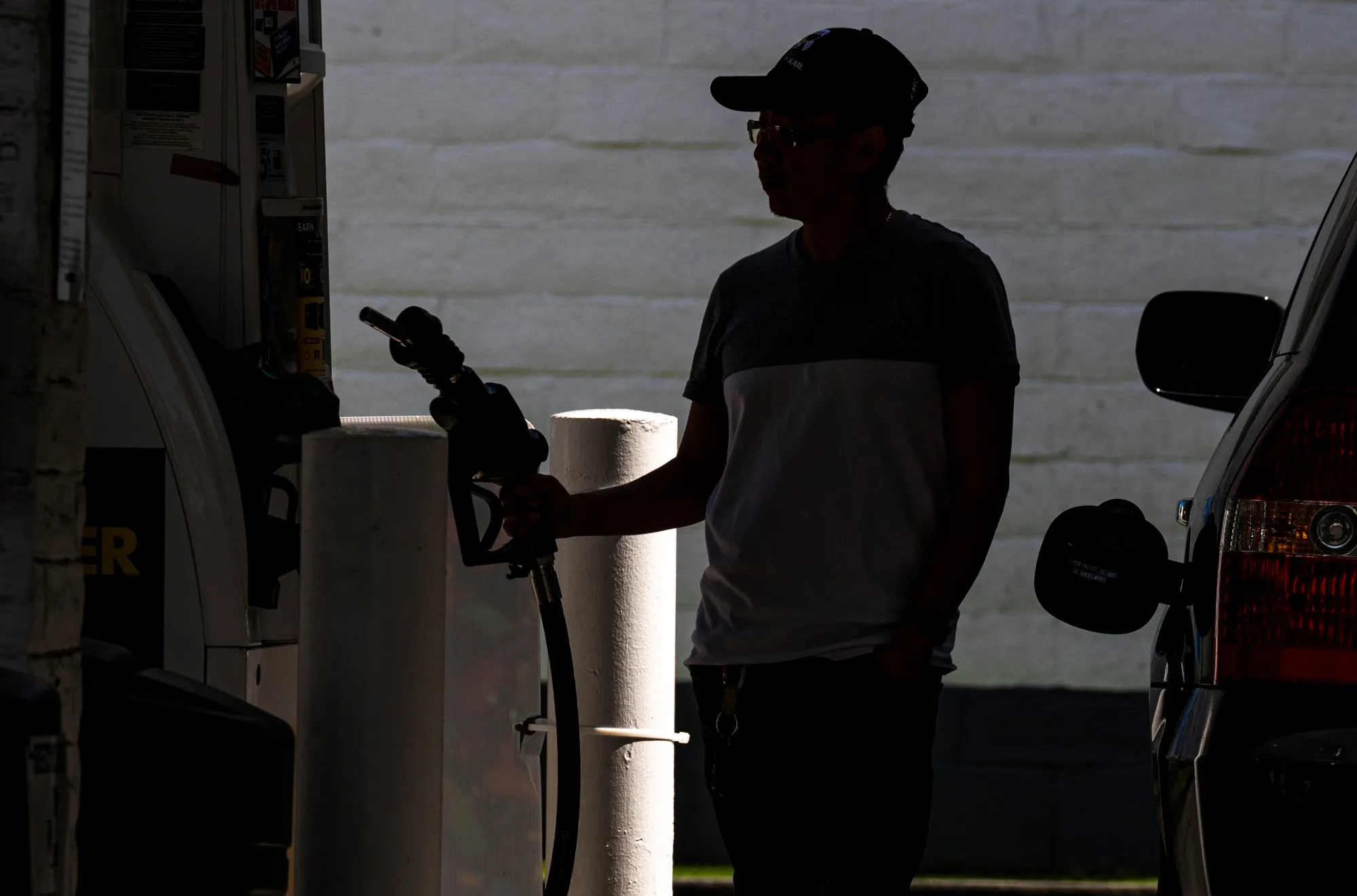 A customer at a gas station in San Francisco, California.