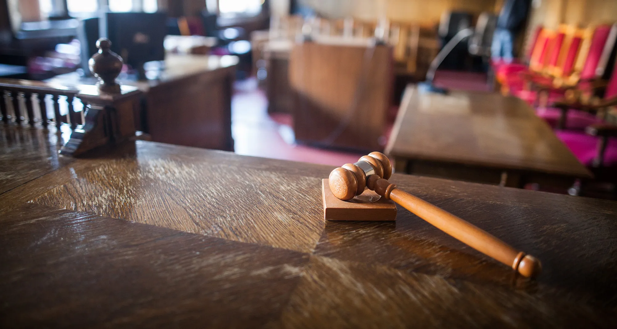Color image of a hammer in a courtroom.