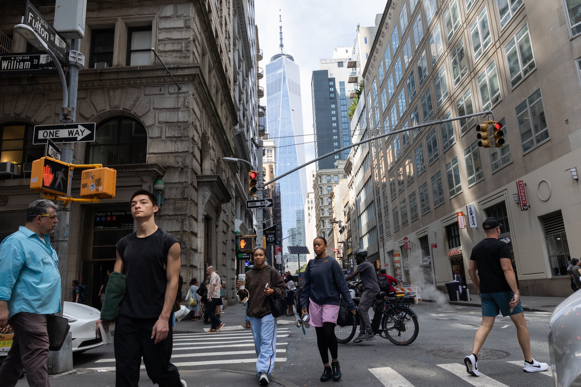 Workers and residents fill Lower Manhattan streets.