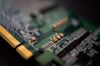 A SK Telecom Co. Sapeon X220 AI semiconductor board is arranged for a photograph at the company's office in Seongnam, South Korea, on Wednesday, Nov. 25, 2020. The Sapeon X220 is designed to speed up servers that cater to a growing number of mobile devices - from drones to self-driving vehicles - that perform better with AI.