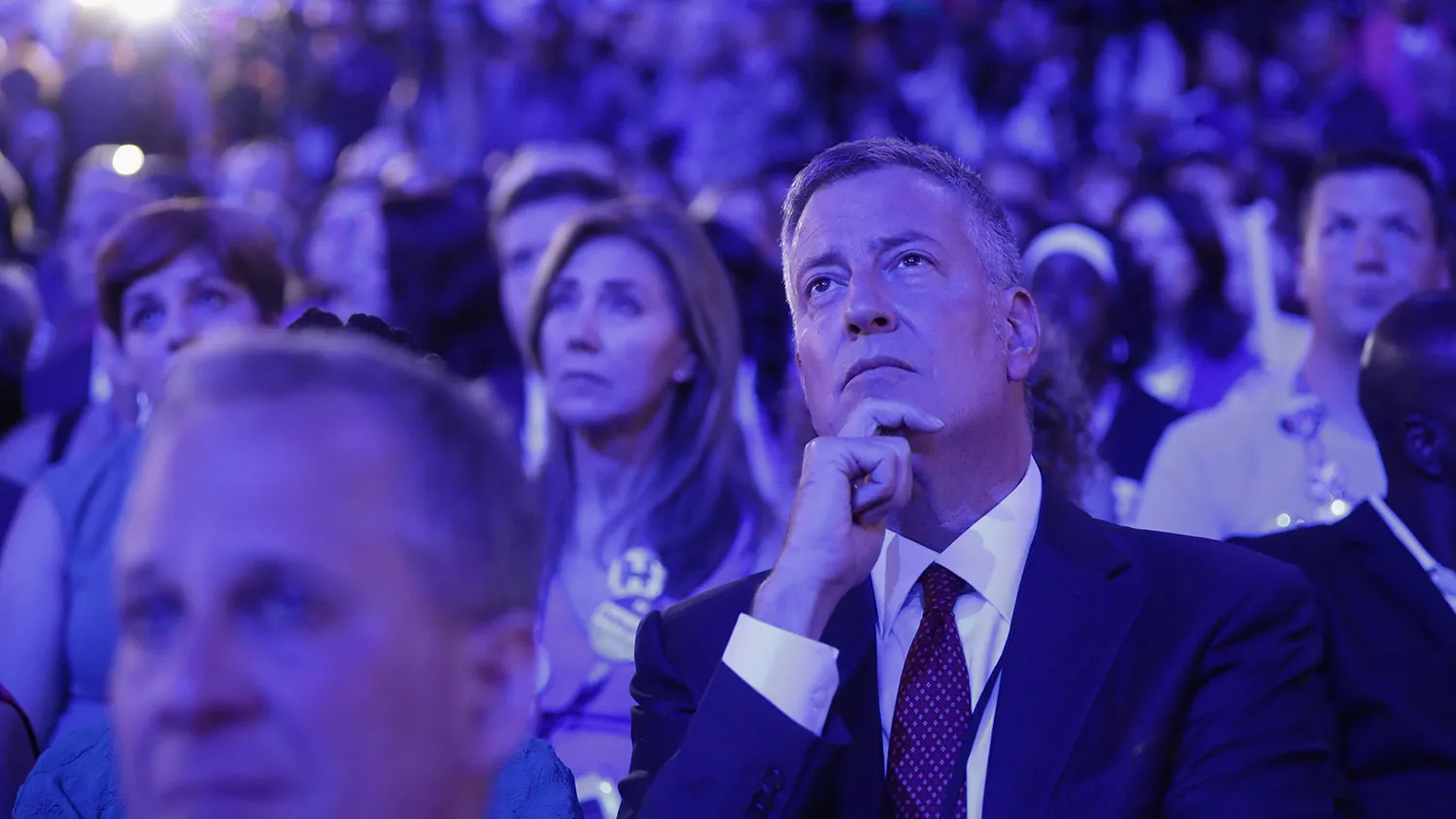 New York City Mayor Bill De Blasio listens to Democratic presidential candidate Hillary Clinton speak on July 28, 2016, in Philadelphia.
