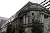 The Bank of Japan (BOJ) headquarters stands in Tokyo, Japan, on Tuesday, July 31, 2018. The central bank left its key interest rates unchanged while announcing policy tweaks, including a shift in purchases of exchange-traded funds toward assets linked to the Topix equities index and flexibility in bond operations.