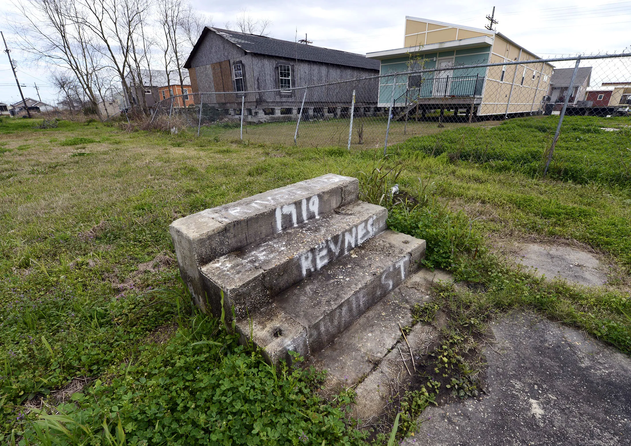 Stairs lead to a vacant lot in the Lower Ninth Ward of New Orleans in 2013.
