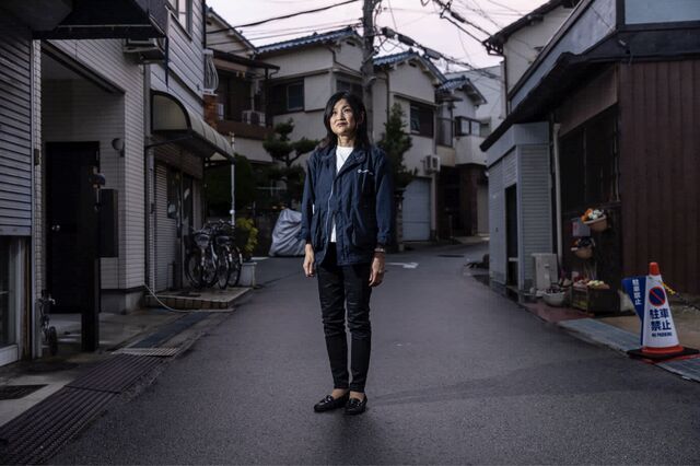 Reiko Katsube, social worker at Toyonaka Social Welfare Council stands in the neighborhood of the office in Toyonaka, Japan on Tuesday Mar. 10, 2020