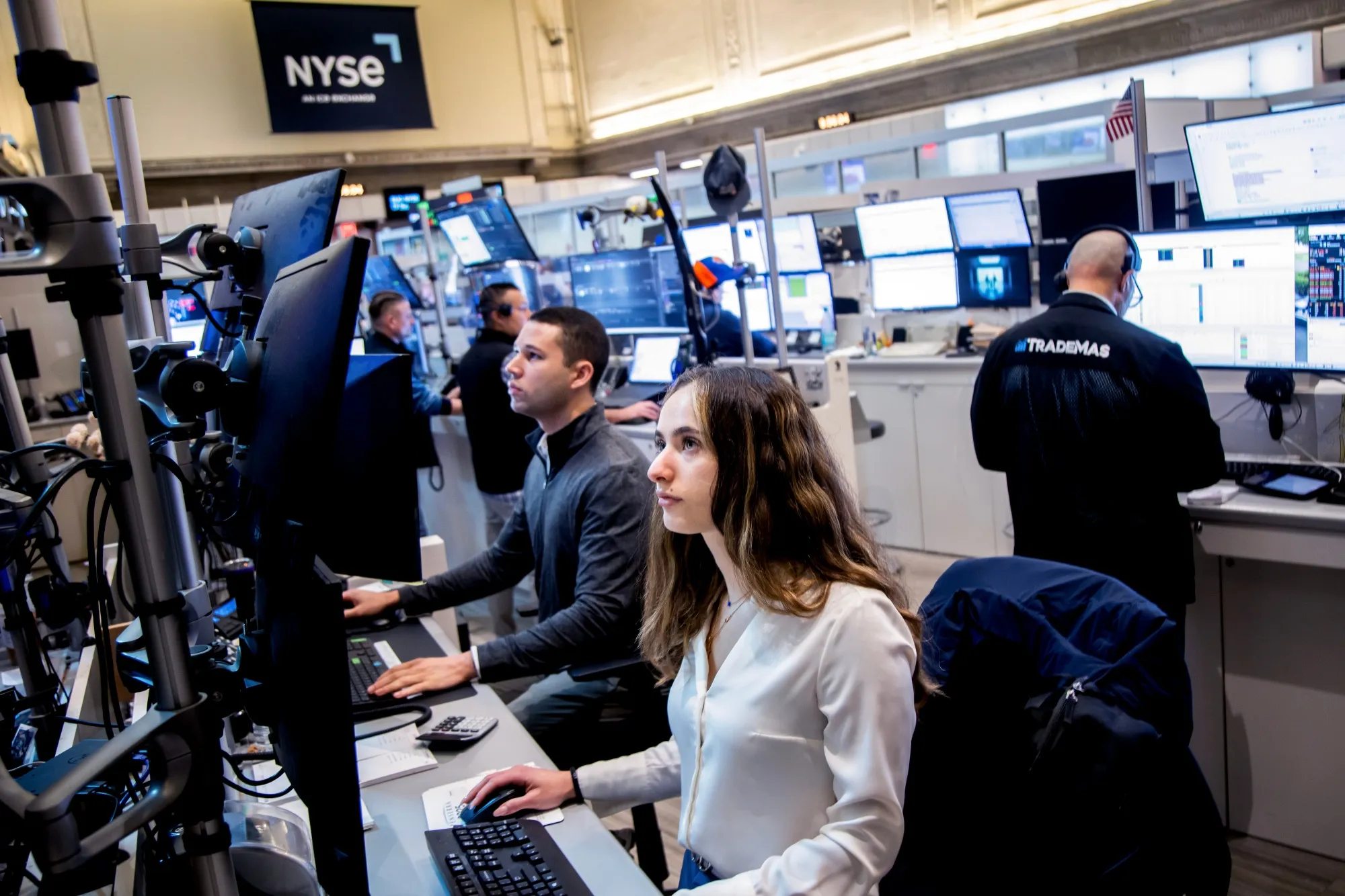 Traders work on the floor of the American Stock Exchange at the New York Stock Exchange on April 10.