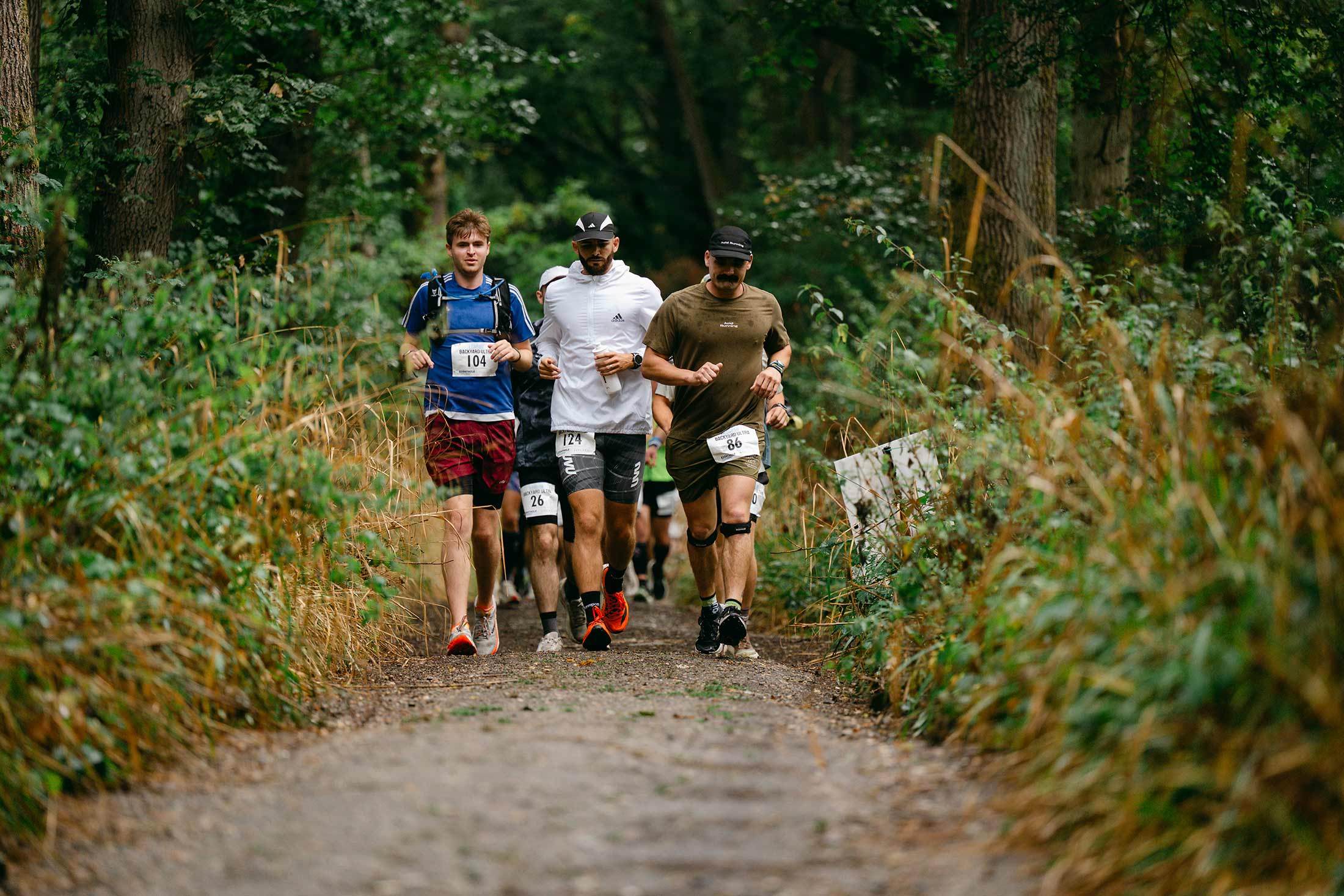Runners compete in a backyard ultra in London.