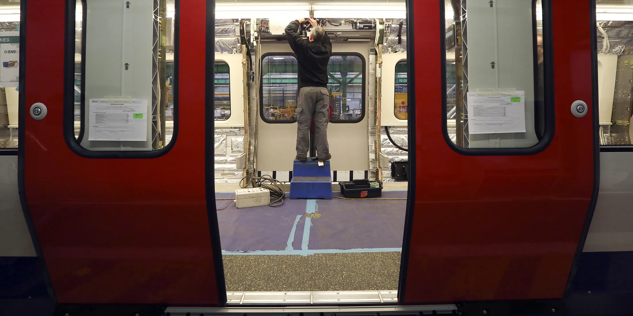 An employee works on a subway carriage at Bombardier’s factory in Derby, U.K.
