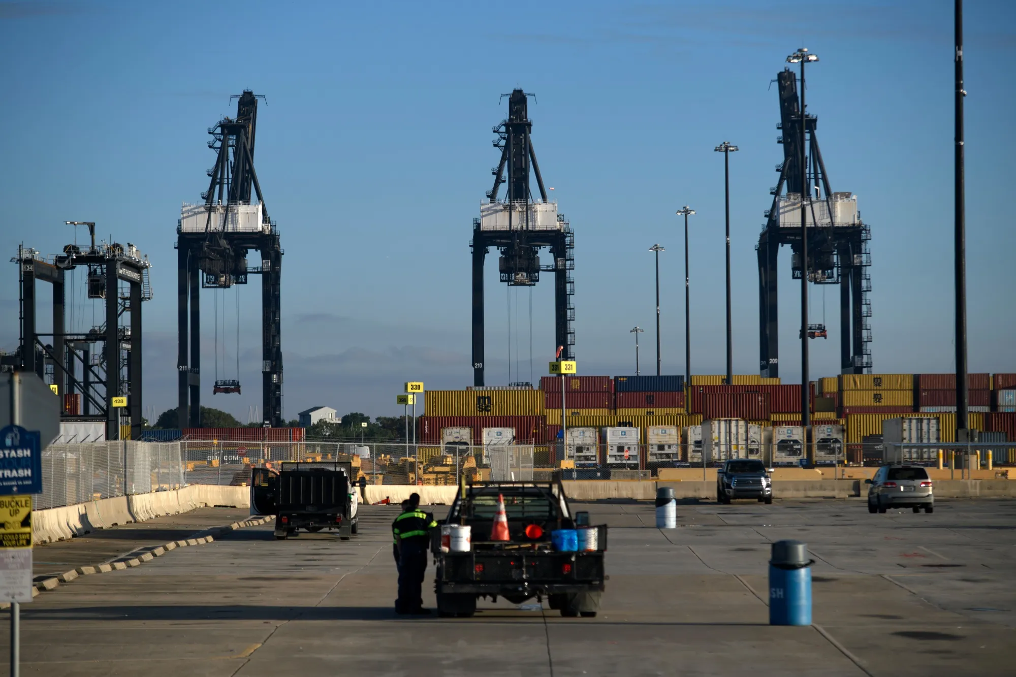 Workers arrive at the Bayport Container Terminal at the port of Houston in Seabrook, Texas, on Oct. 4.