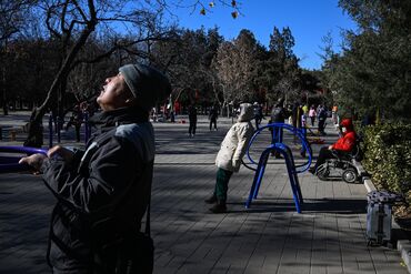 People exercises at a park in Beijing