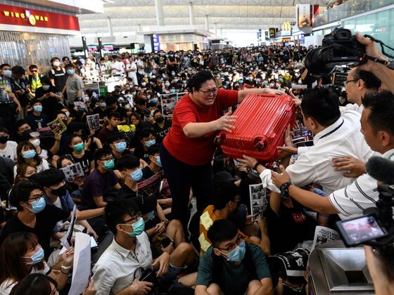 Airport Cleans Up After Night of Protest Chaos: Hong Kong Update