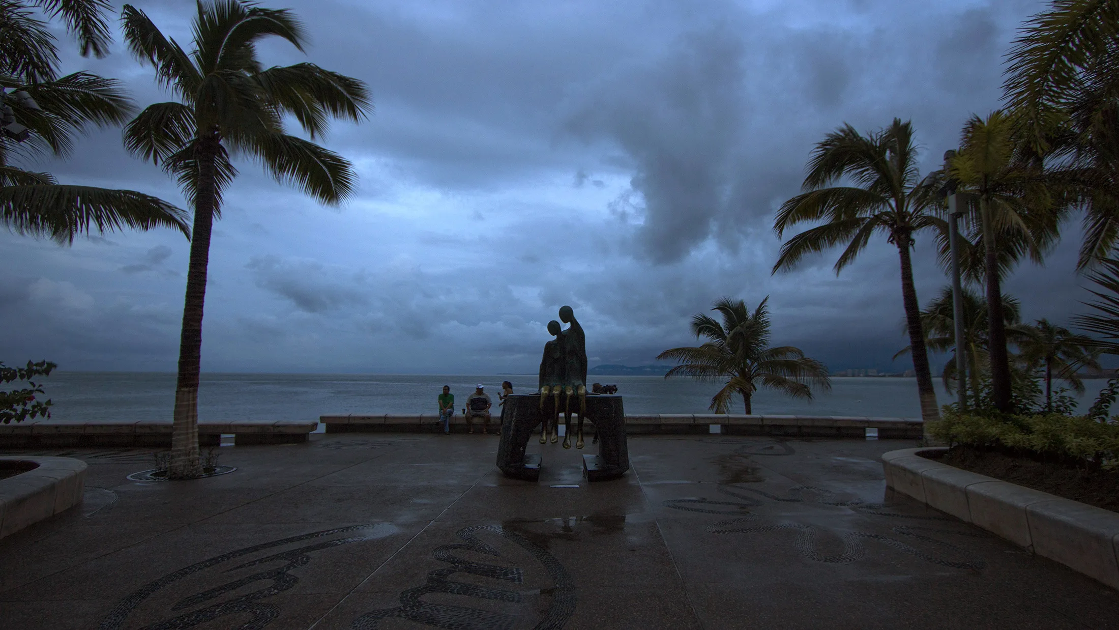 People sit near a breakwater after the arrival of hurricane Patricia in Puerto Vallarta, Mexico, on Oct. 24.
