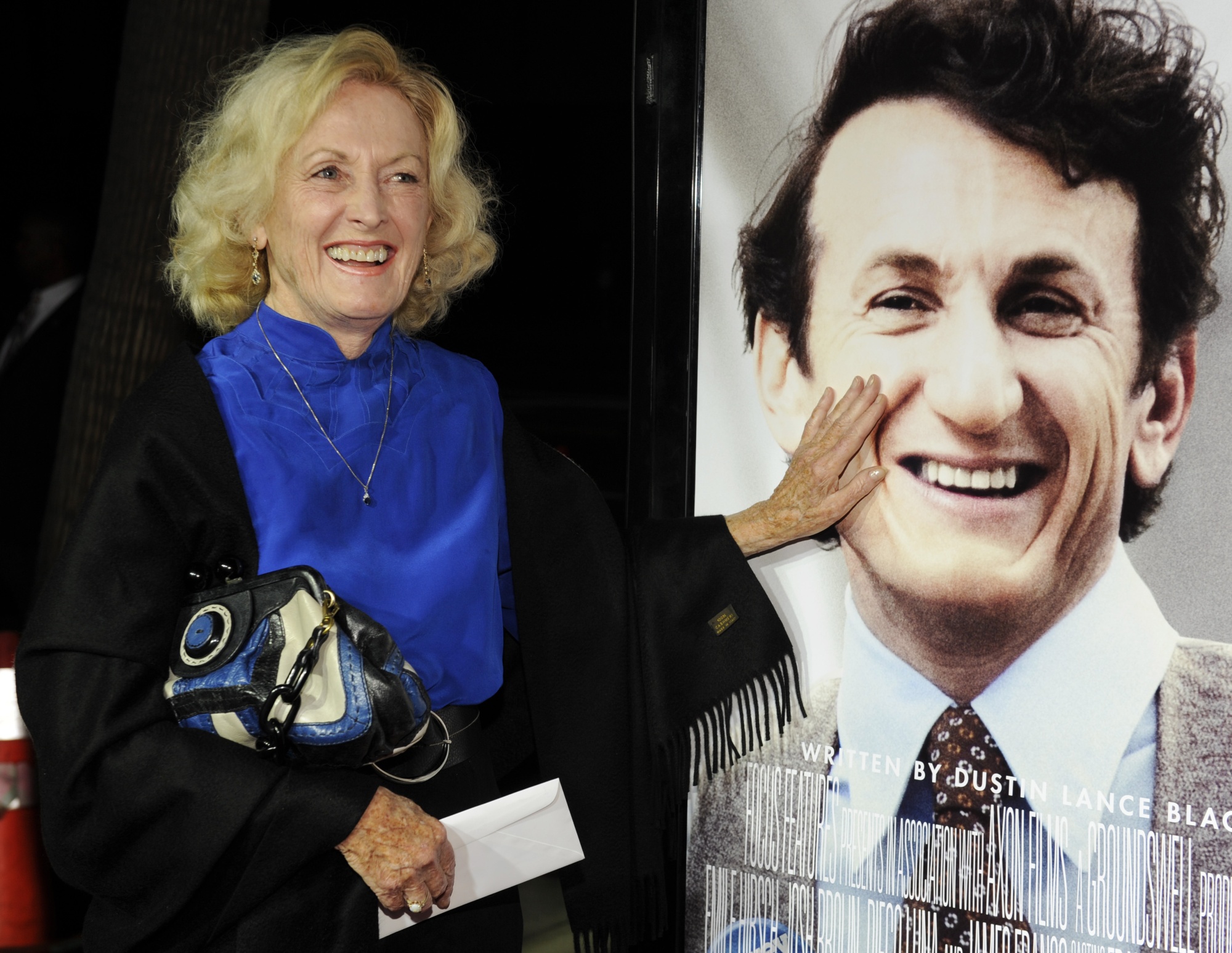 Eileen Ryan, mother of actor Sean Penn, touches her son's image on the poster at the premiere of &quot;Milk&quot; in Beverly Hills, Calif., on Nov. 13, 2008.  (AP Photo/Chris Pizzello, File)