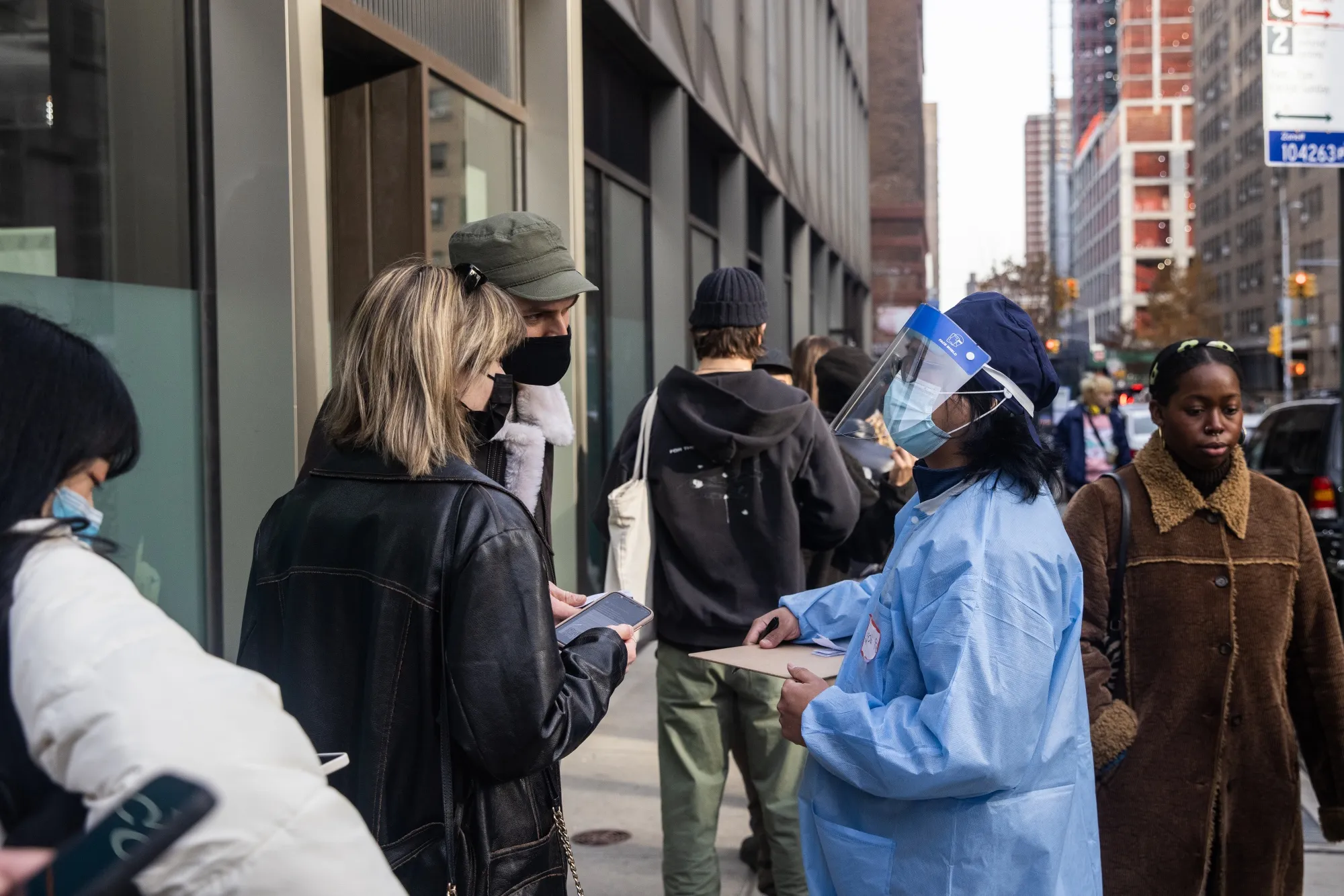 A healthcare worker assists residents at a Covid-19 vaccination site in New York on Dec. 5.