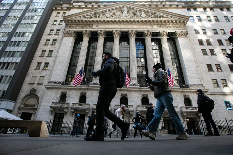 Pedestrians in front of the New York Stock Exchange (NYSE) in New York, US.