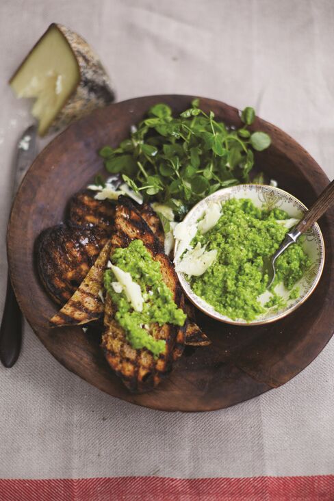 The best mushy peas you've ever had: fresh, raw, and crushed with a little olive oil and cheese.