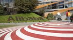 Employees walk through the campus at the Alibaba Group Holding Ltd. headquarters.