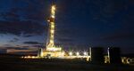 An oil drilling rig stands on the Bakken formation in Watford City, North Dakota.