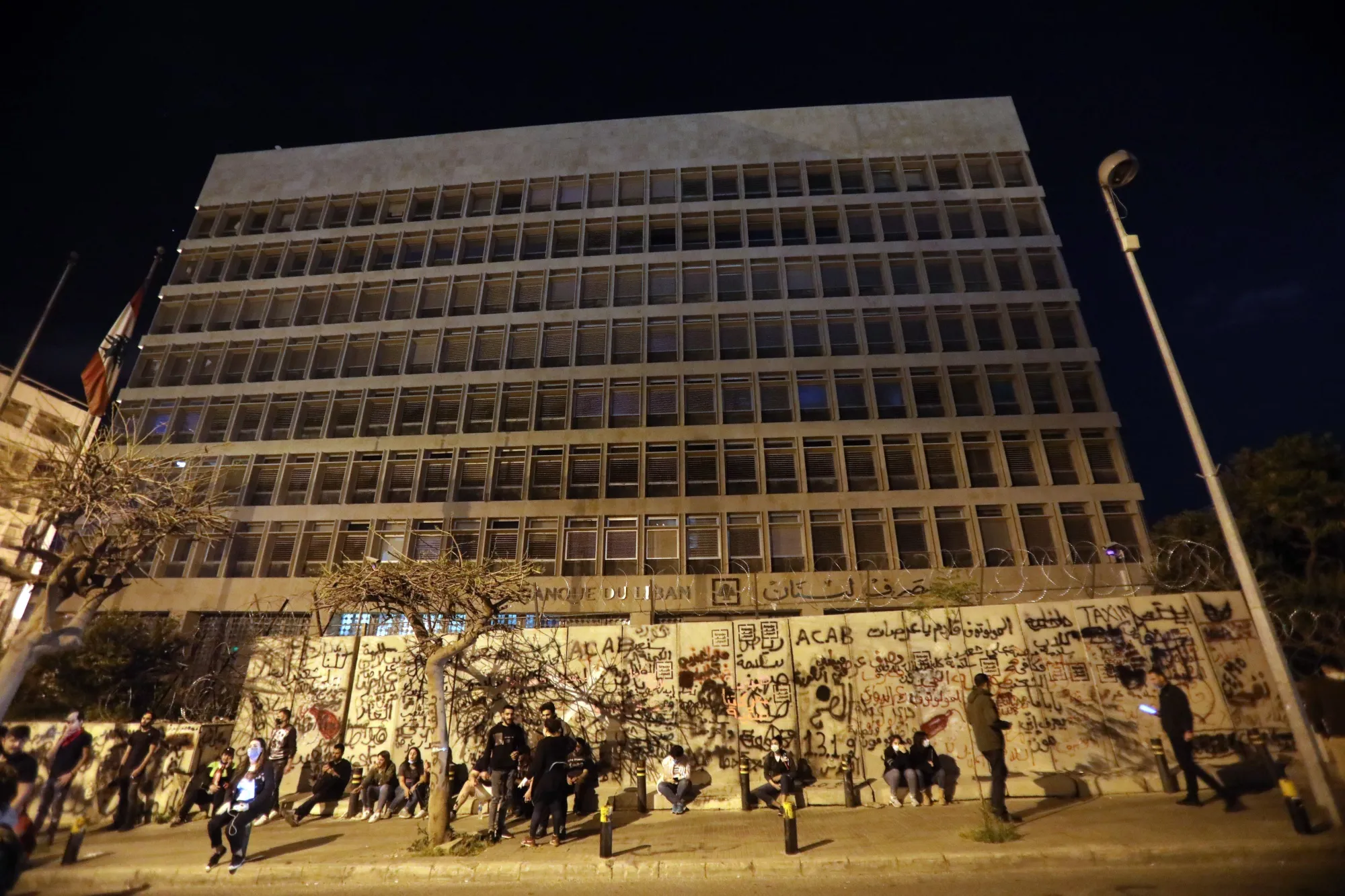 Protesters gather outside the headquarters of the Lebanese central bank in Beirut, on April 28.