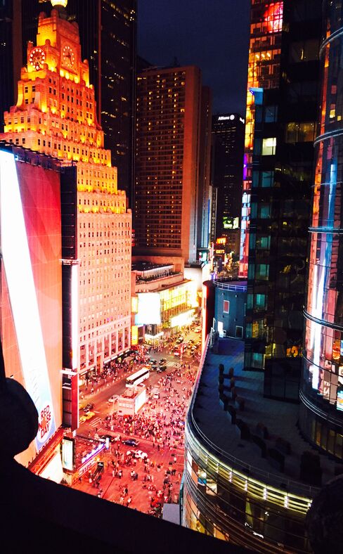 Times Square's Broadway, by night, as seen from the St. Cloud rooftop at the Knickerbocker Hotel.