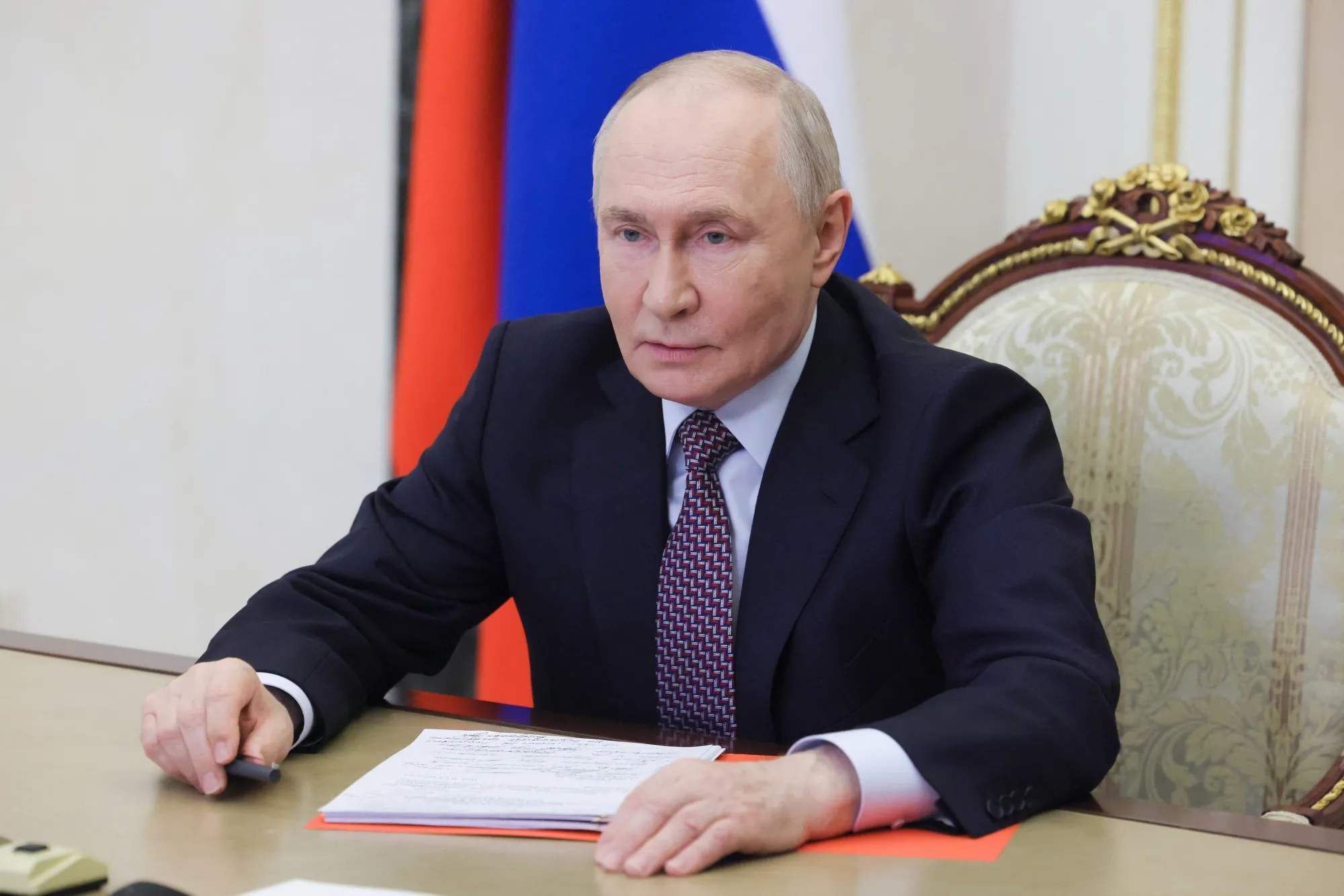 Vladimir Putin chairs a Security Council meeting via videolink in Moscow on May 8, in a photograph distributed by the Russian state agency Sputnik.
