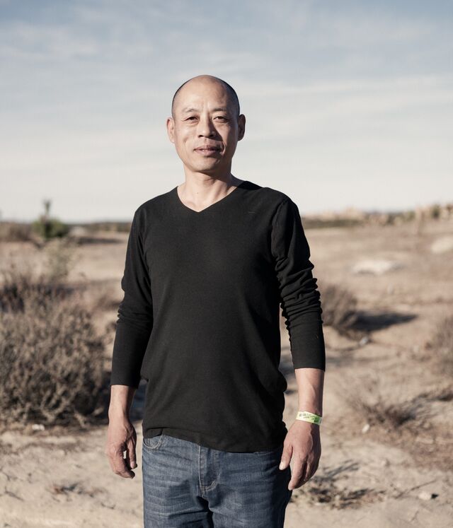  A portrait of Li Gong, an asylum seeker from China, standing in the desert in Boulevard.  