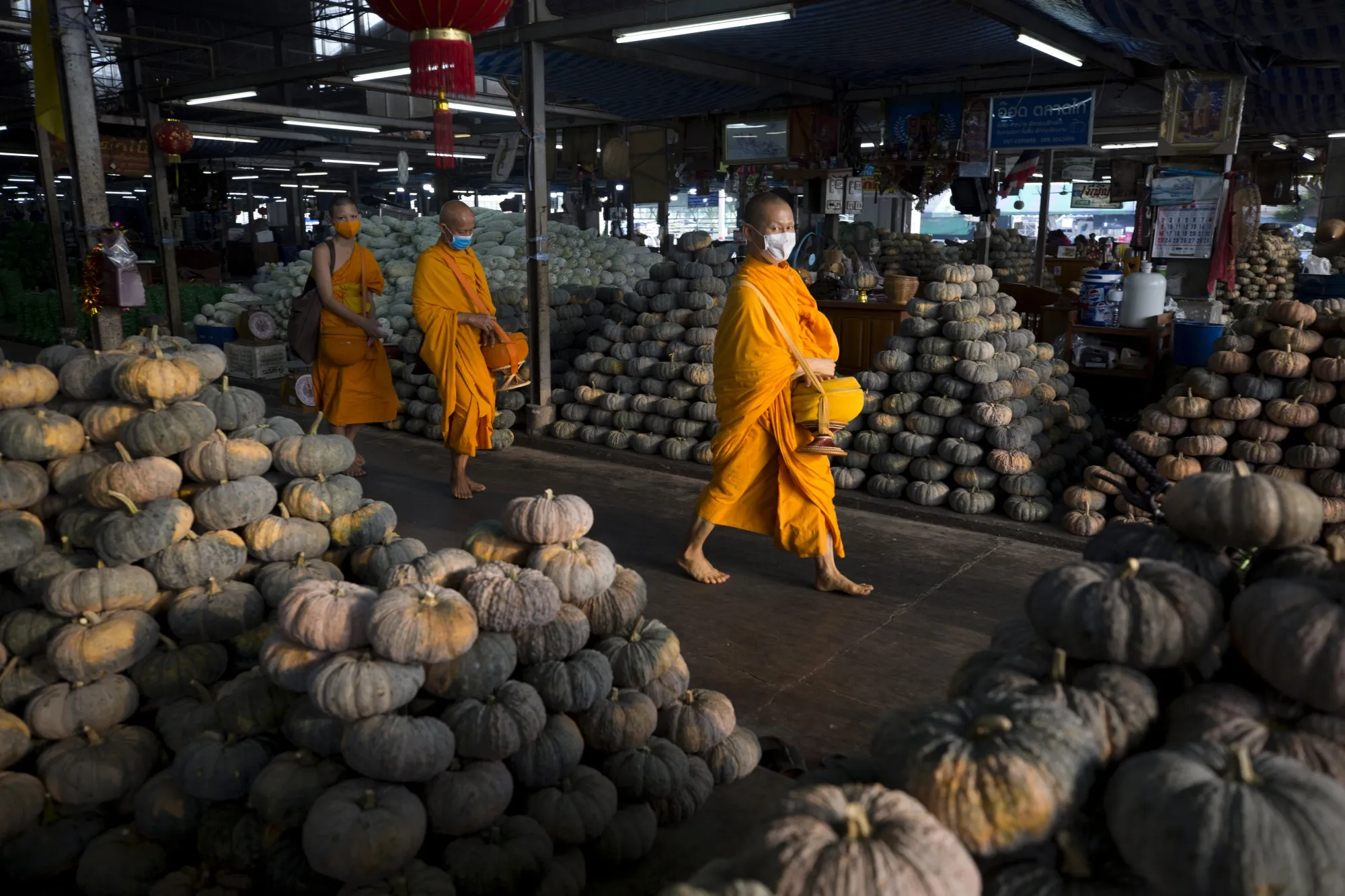 Buddhist monks at the Talat Thai wholesale market in Pathum Thani, Thailand, on April 14.