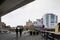 People walk at the High Line Park toward the new Whitney Museum of American Art, back right, in New York, U.S., on Thursday, April 23, 2015. Photographer: Chris Goodney/Bloomberg