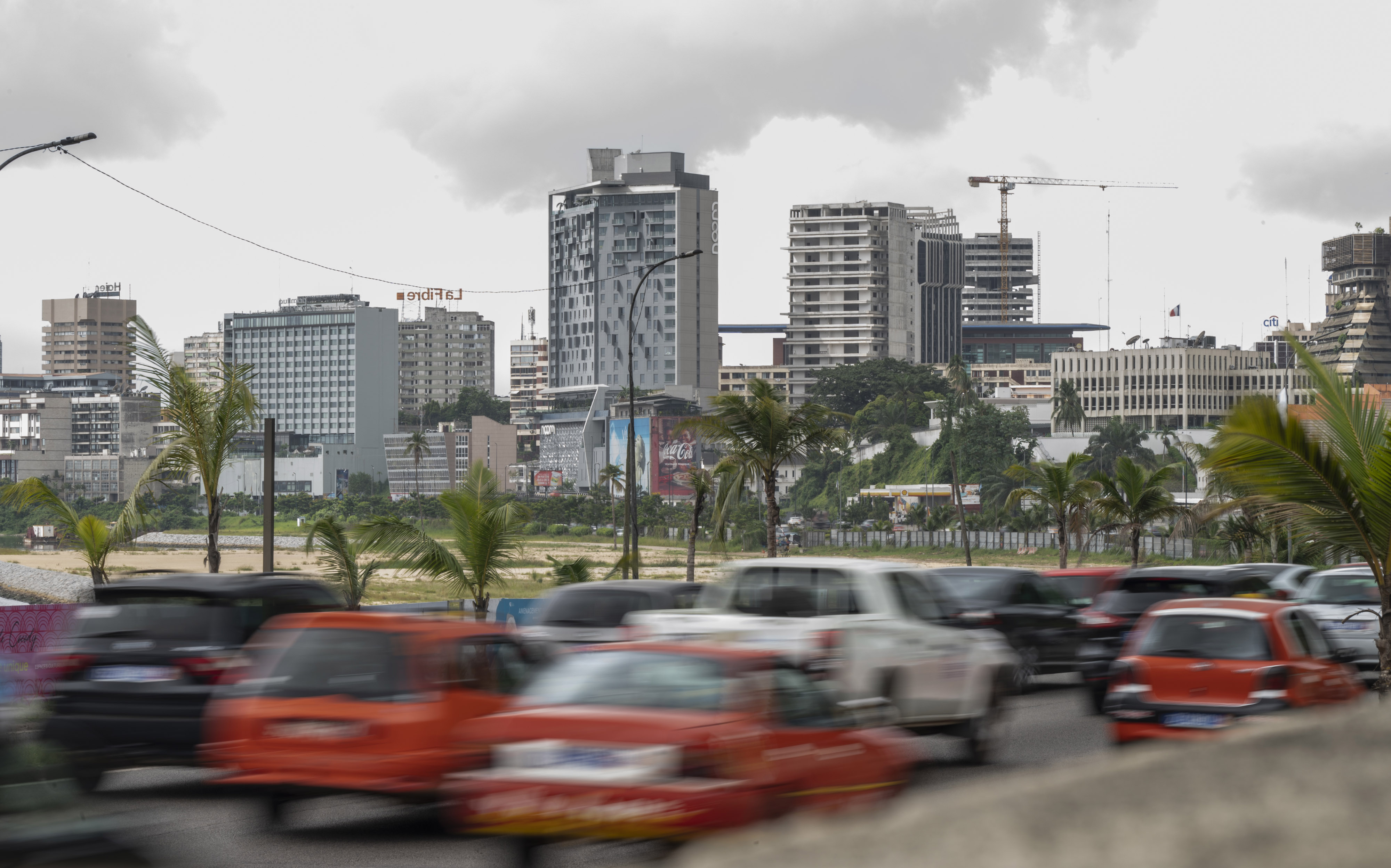 Morning rush hour traffic heads towards the Plateau business district of Abidjan, Ivory Coast, on Monday, May 16, 2022. Surging international food prices will hit Africa’s economies the hardest and may trigger social unrest if governments fail to cushion the blow, according to a report by Oxford Economics Africa. Photographer: Andrew Caballero-Reynolds/Bloomberg