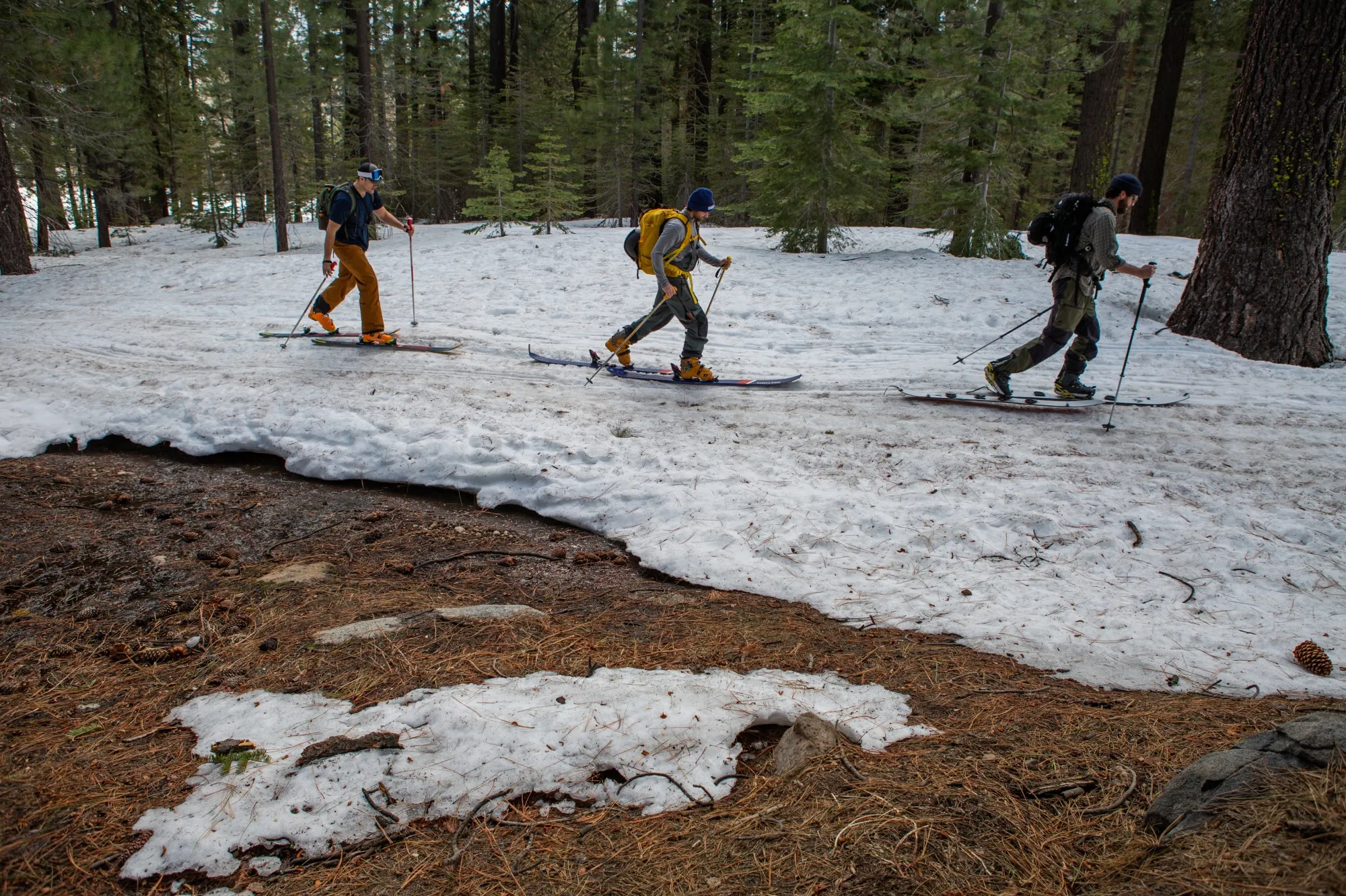 Cross country skiers on melting snow at Johnson Canyon in Soda Springs, California, in March.
