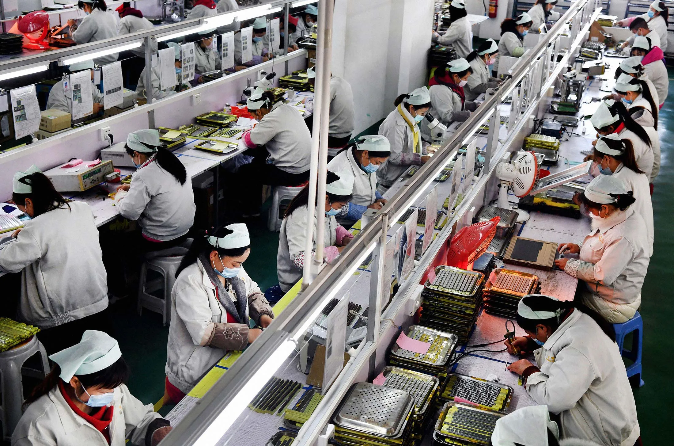 Workers at an electronic technology company in&nbsp;China’s Shaanxi province on March 4.