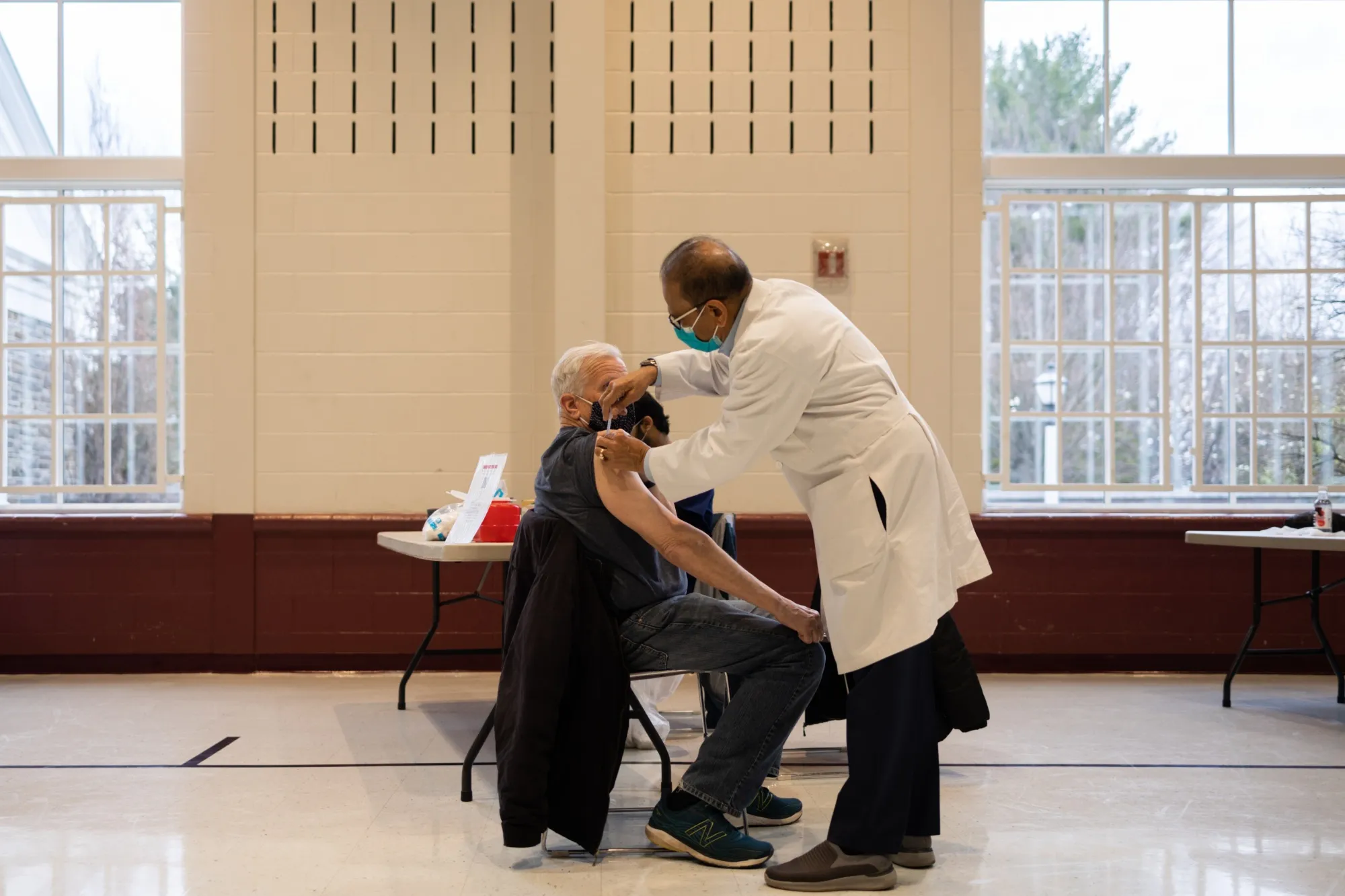 A healthcare worker administers a Covid-19 booster shot to a resident at a vaccine clinic in Pennsylvania, U.S.