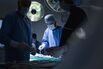 Surgeons working in operating room