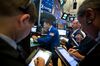 Traders work on the floor of the New York Stock Exchange (NYSE) in New York, U.S., on Monday, Aug. 21, 2017. U.S.