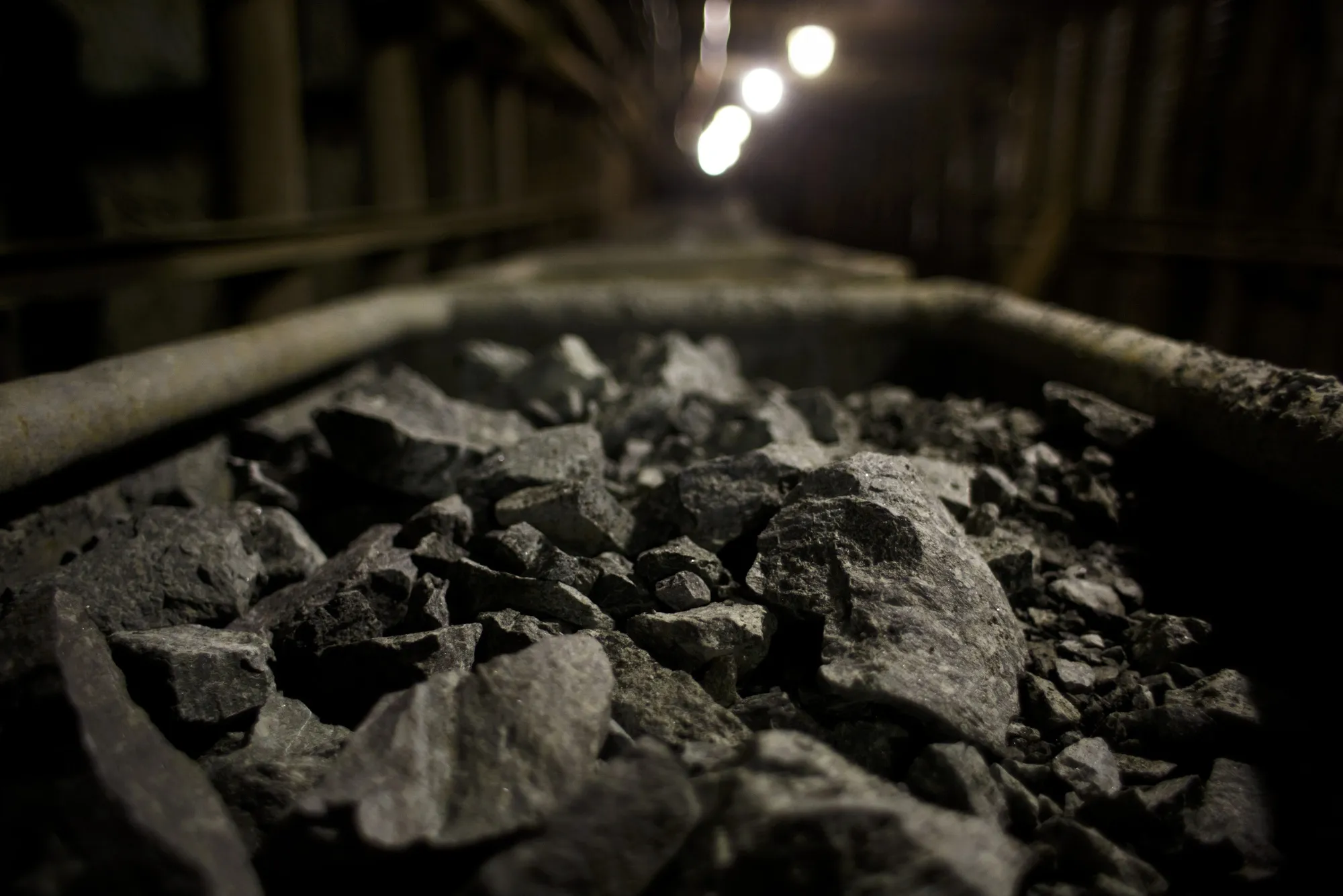 Rocks containing uranium ore sit in rail trucks.