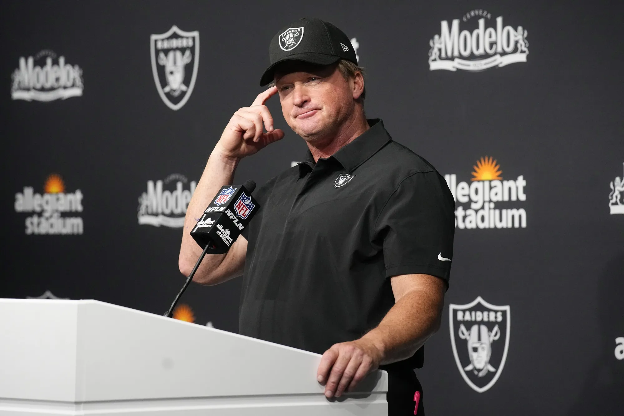 Las Vegas Raiders head coach Jon Gruden attends a news conference after an NFL football game against the Miami Dolphins in Las Vegas, in this Sunday, Sept. 26, 2021, file photo. Jon Gruden is out as coach of the Las Vegas Raiders after emails he sent before being hired in 2018 contained racist, homophobic and misogynistic comments. Gruden released a statement Monday night, Oct. 11, 2021, that he is stepping down after The New York Times reported that Gruden frequently used misogynistic and homophobic language directed at Commissioner Roger Goodell and others in the NFL.(AP Photo/Rick Scuteri, File)