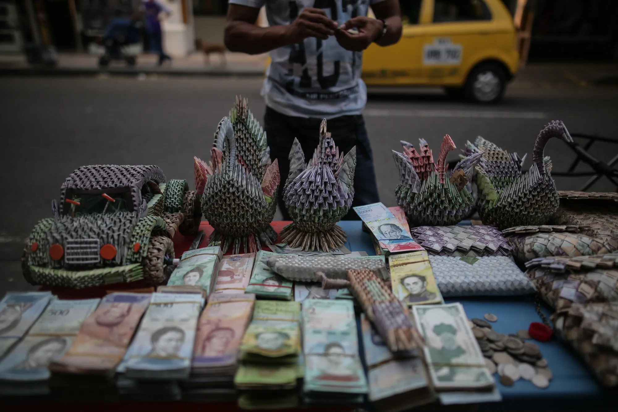 A vendor sells sculptures, made from Venezuelan Bolivar banknotes, near the Simon Bolivar International Bridge in the town of La Parada on the outskirts of Cucuta, Colombia.