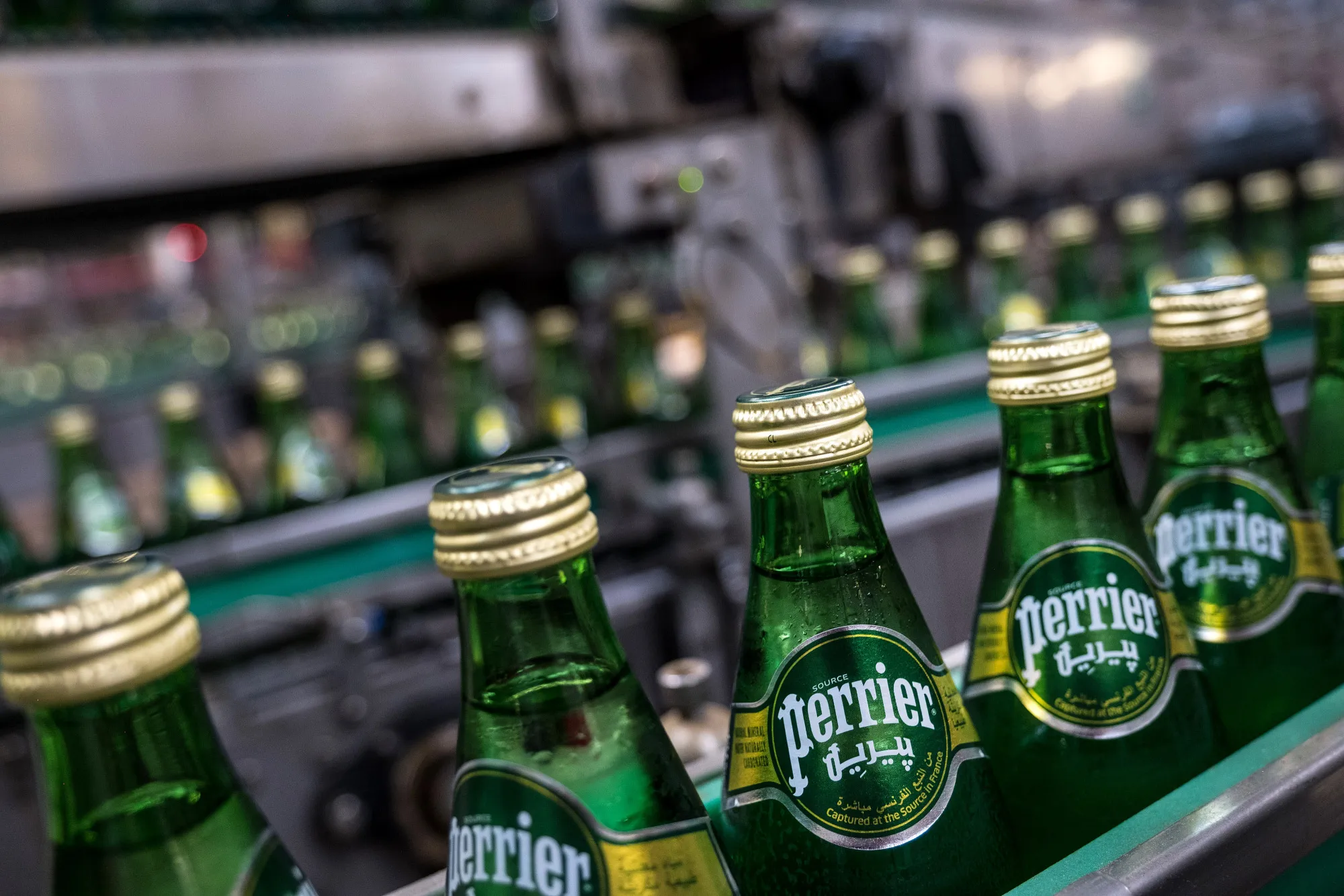 Bottles of Perrier mineral water on&nbsp;the production line in Vergeze, France.
