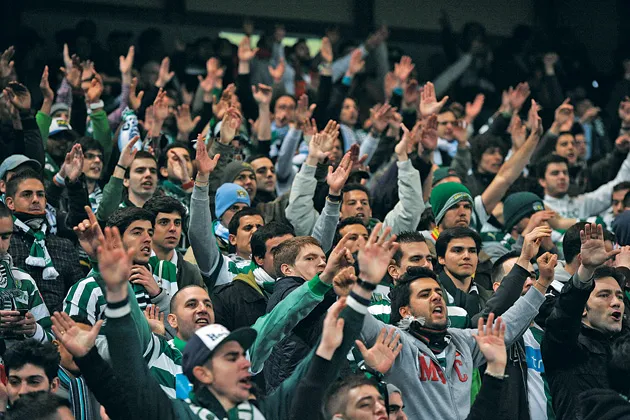 Sporting Lisbon fans celebrate a big win over Manchester City in March
