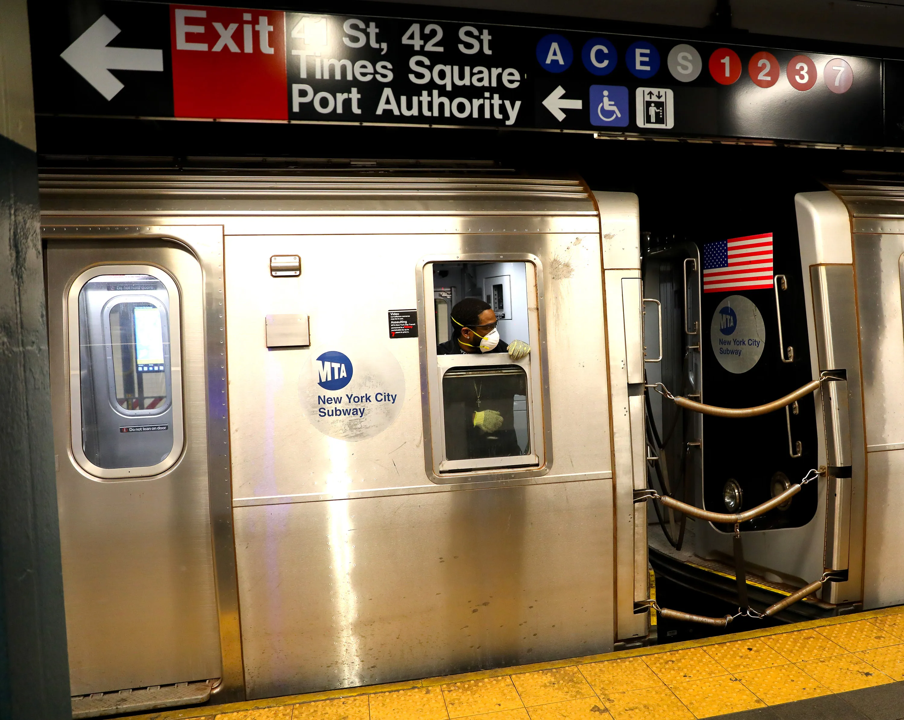 An MTA worker wears a mask while operating a train on April 18.