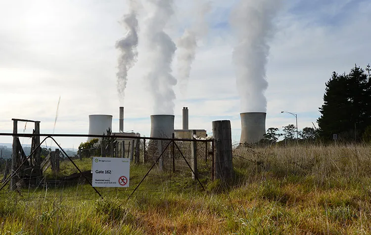 Steam billows from the cooling towers at the Loy Yang A coal-fired power station, operated by AGL Energy Ltd., front, and Loy Yang B coal-fired power station, co-owned by GDF Suez Australian Energy and Mitsui &amp; Co., rear, on the outskirts of Traralgon, Australia.
