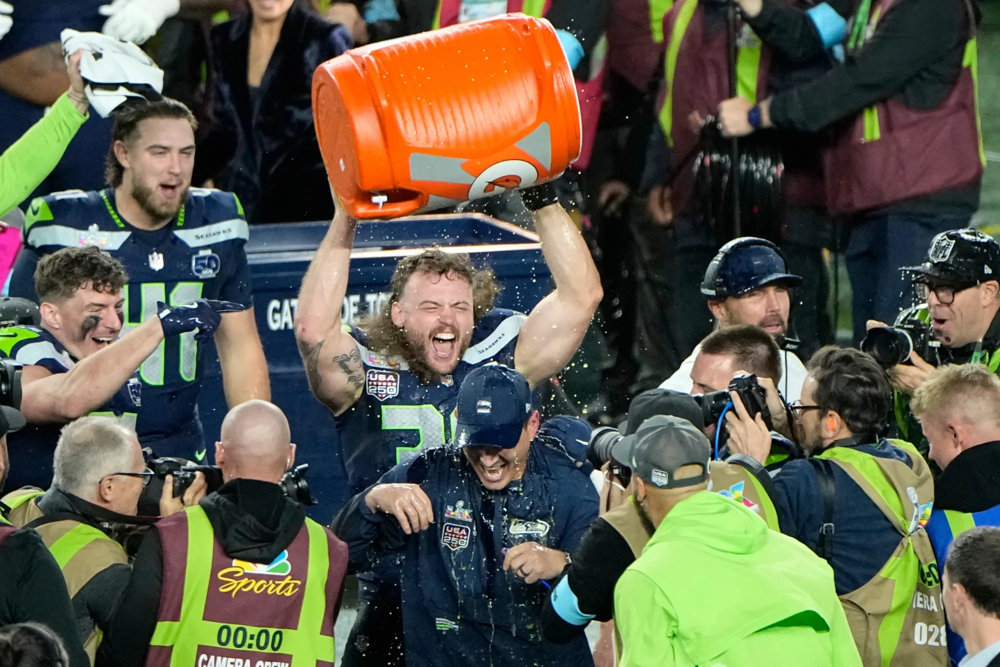 Seattle Seahawks head coach Mike MacDonald, center, is doused after his team's win in the Super Bowl against the New England Patriots on Feb. 8.